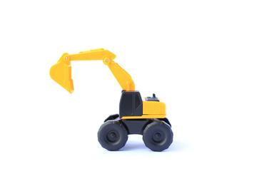The yellow toy car Excavator isolated on white background. Children's backhole toy model.