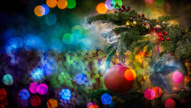 Christmass Tree And Bokeh Lights On The Background. Christmas Card With Copy Space.