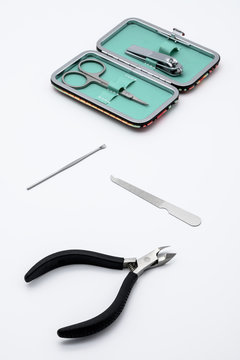 Set of manicure instruments and tools with the case isolated on white background. Scissors, Nail Cutter, Cuticle Pusher, Cuticle Nipper, Nail Buffer, Nail File, Nail Brush.