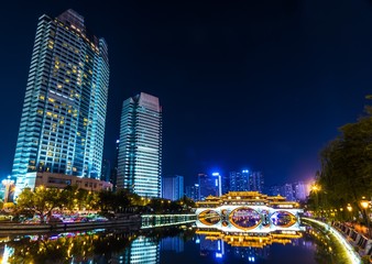 Night city view near the Anshun bridge in Chengdu, Sichuan, China. 
 Modern skyscrapers in Chinese metropolis city.