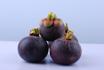 asian tropical mangosteen fruit on white background