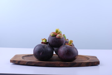 asian tropical mangosteen fruit on white background