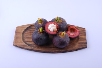 asian tropical mangosteen fruit on white background