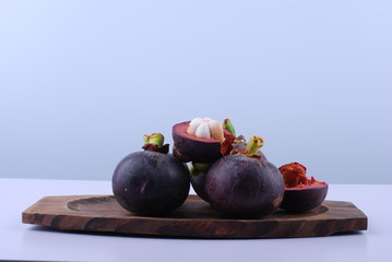 asian tropical mangosteen fruit on white background