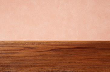 Empty wooden floors on pink wallpaper background