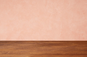 Empty wooden floors on pink wallpaper background