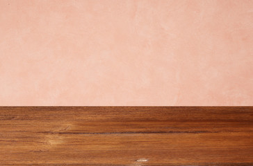 Empty wooden floors on pink wallpaper background
