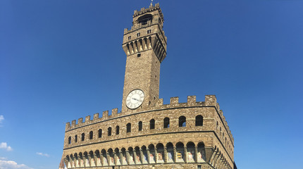 Obraz premium Clock Tower and Embattlements on Palazzo Vecchio in Florence