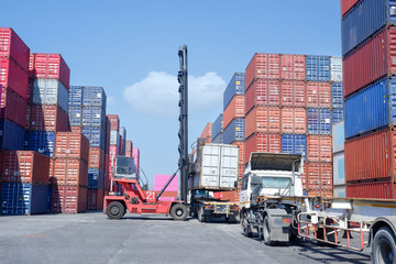 Logistics and transportation of harbor, container truck, container forklift, the concept of export and import in transportation