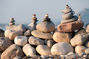 Fototapeta na wymiar The stones were piled one on top of the other on the pebbly beach, during the rest and joyous mood