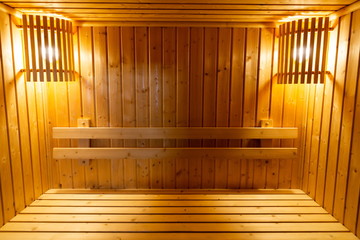 wooden bench and wall in sauna steam baked room , interior