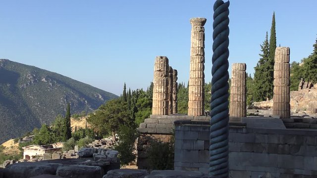 Serpentine Column, Plataean Tripod or Delphi Tripod in front of the temple of Apollon in Delphi, Greece