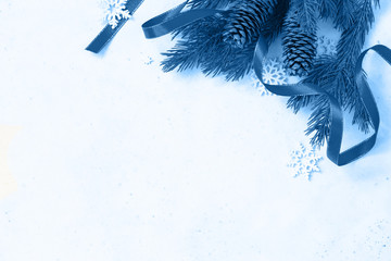 Classic blue 2020. Gradient color palette. Christmas, new year concept background. Branches of spruce and decorations. Copy space.