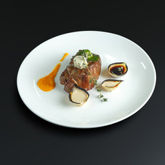 Dishes of traditional Russian cuisine. Restaurant serving. Black background.