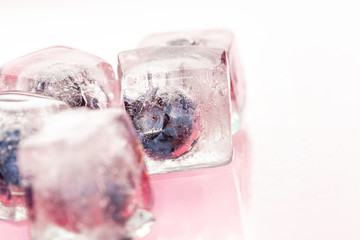 Ice cubes with berry for summer cocktails