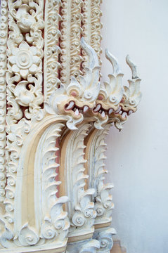 carveing art of tree naka head and flower  thai style in one hundred year tample