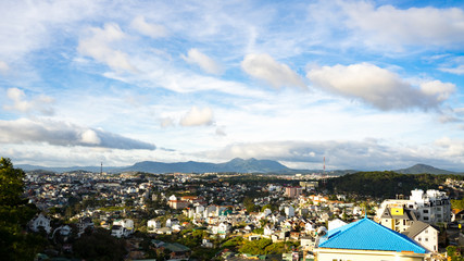 Cityscape of Dalat, Vietnam.Beautiful landscape view for mountains and buildings.Beautiful tiny houses.Da lat city in the blue sky background