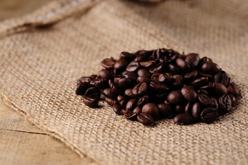 Heap of coffee beans on a jute sack