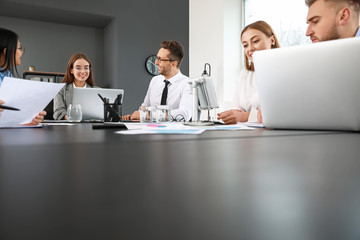 Colleagues discussing issue at business meeting in office