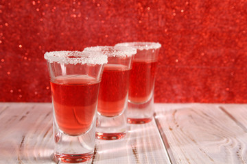 Three glasses with alcoholic drinks