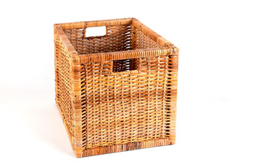 Cube-shaped wicker basket on a white background.