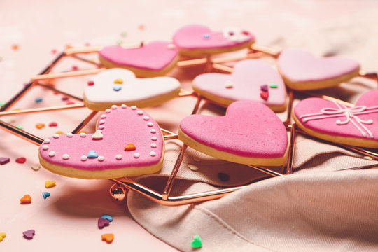 Tasty heart-shaped cookies on color background. Valentines Day celebration