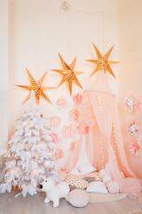 Pink Christmas background with new year trees and other holiday decor, new year background
