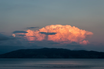 The moon and a storm cell over the Albanian coastline