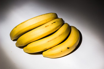 banana picture eating, banana bunch isolated, yellow bananas, bunch bananas isolated, bananas ripeness, bananas, tropical yellow pattern, banana closeup, bunch of bananas Bananas isolated on white. 