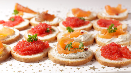 buffet food, dining appetizer snack, canape with salmon and caviar