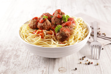 bowl of spaghetti, meatball and tomato sauce