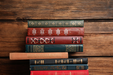 Collection of different books on wooden background