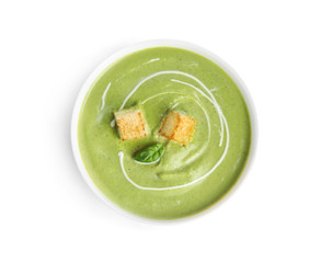 Delicious broccoli cream soup with croutons isolated on white, top view