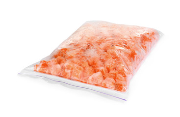 Frozen carrots in plastic bag isolated on white. Vegetable preservation