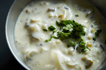 White cream sauce with dried parsley 