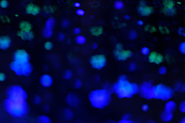 Fototapeta na wymiar Abstract dark background with blue lights. Bokeh, blur