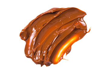 Melted tasty caramel splashes isolated on white background.