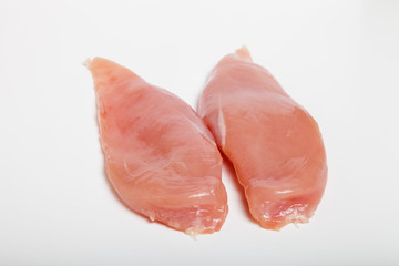 Raw chiken meat on a light background