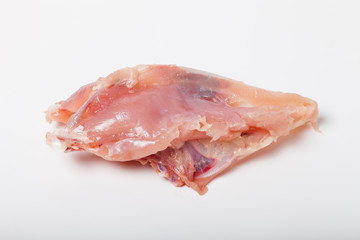 Raw chiken meat on a light background