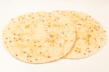 Pitta bread with seeds isolated on white