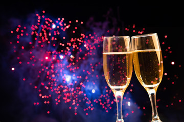 New Year concept with champagne and fireworks.