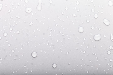 Drops of water on a color background. Selective focus. Gray