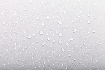Drops of water on a color background. Selective focus. Gray