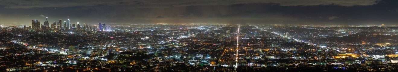 Aerial panoramic night view of Los Angeles metropolitan area; Financial District and the downtown area visible on the left