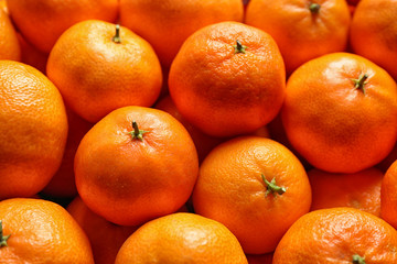 Delicious fresh ripe tangerines as background, closeup