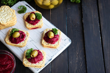 Beetroot relish on crackers. An original party snack.