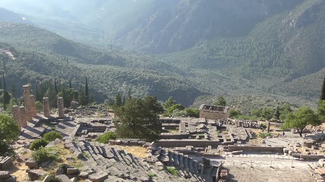 Ancient theatre of Delphi with temple of Apollo , panoramic view from above