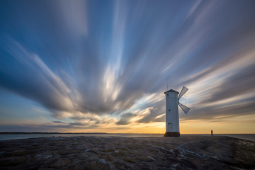 Fototapeta premium Lighthouse windmill Stawa Mlyny, Swinoujscie, Baltic Sea, Poland.