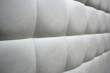 Headboard with decor. Selective focus. Close-up photo.