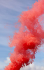 Red smoke on a blue sky